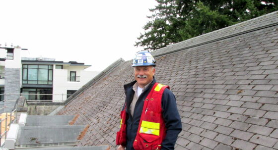 Klein standing on a roof