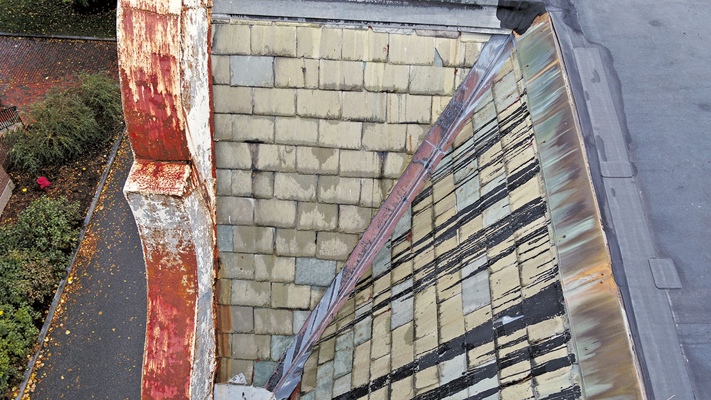 damaged sloped gable slate roofs