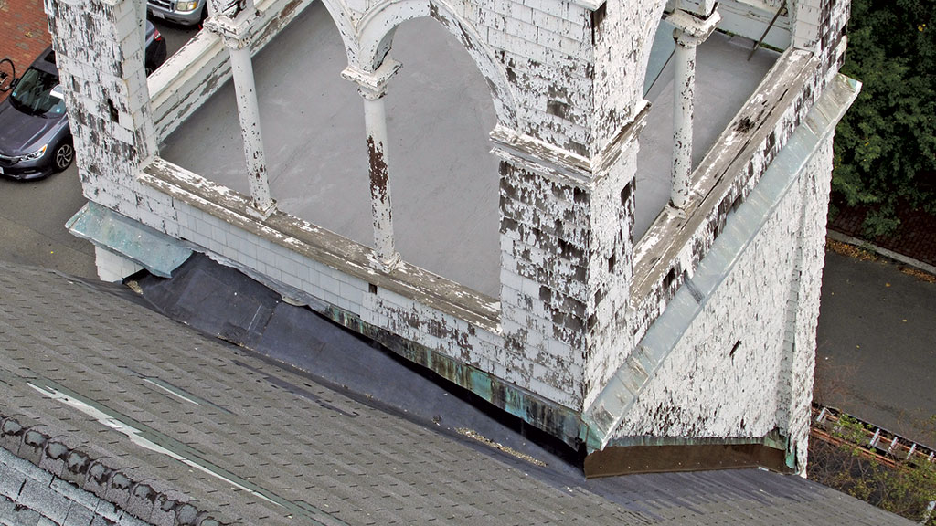 damaged church chimney and cricket