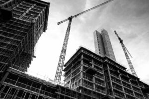Black and white building under construction.
