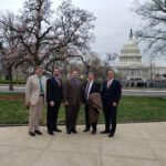 Five RCI leaders standing in front of the Capitol